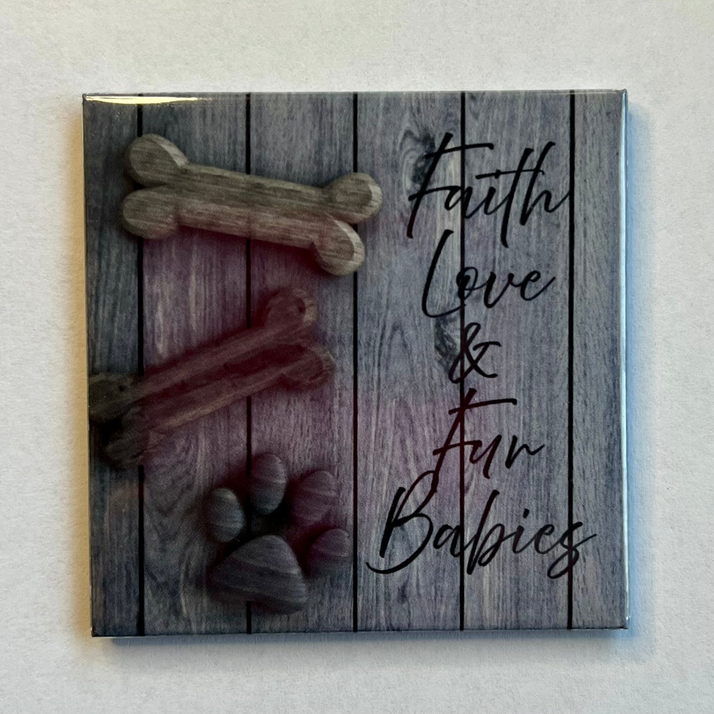Dog lover faith magnet with wooden background reading Faith Love and Fur Babies