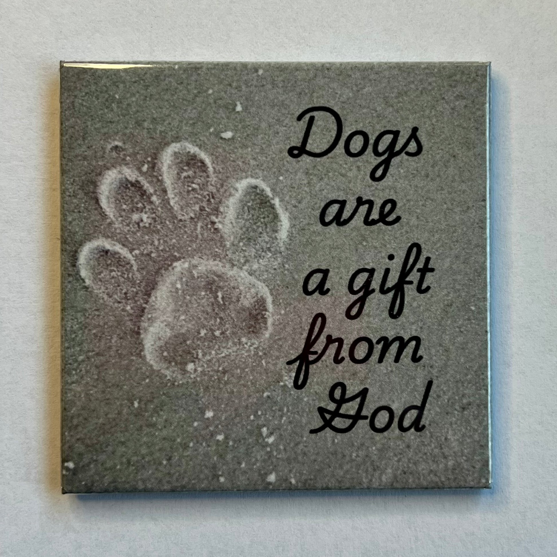 Christian dog magnet with beach sand background and paw print reading Dogs Are a Gift From God