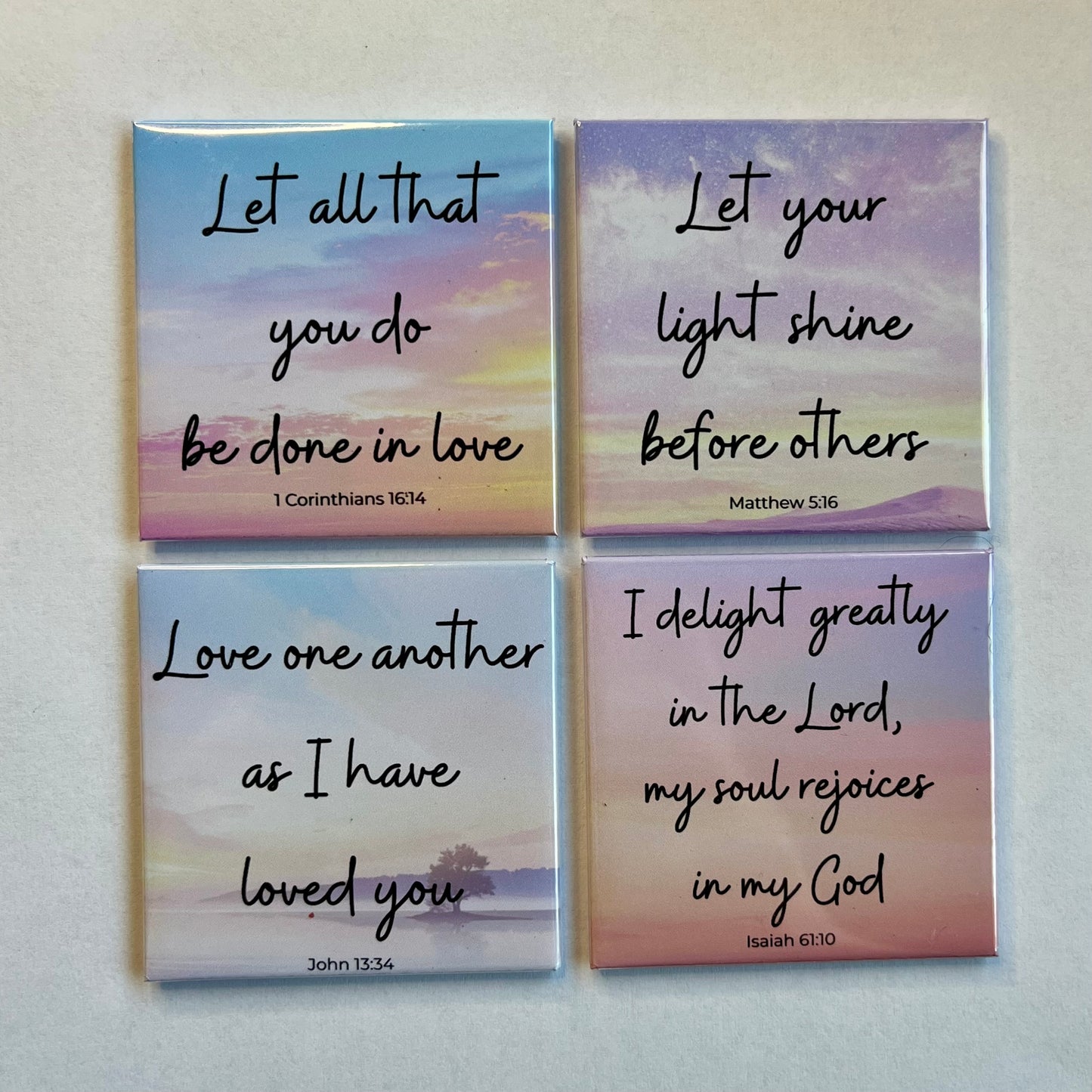 Set of four Love and Kindness Christian scripture magnets displayed on a white background