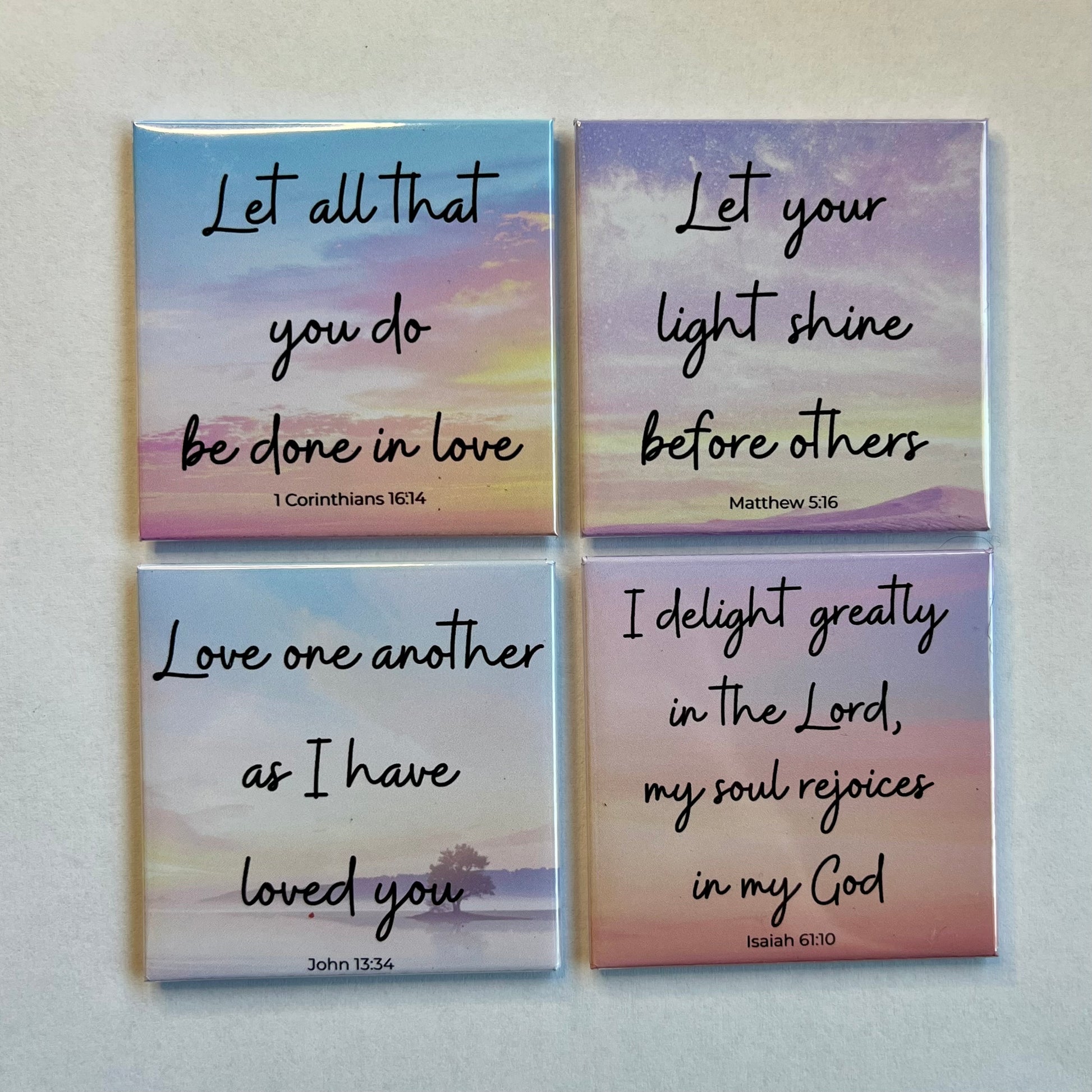 Set of four Love and Kindness Christian scripture magnets displayed on a white background