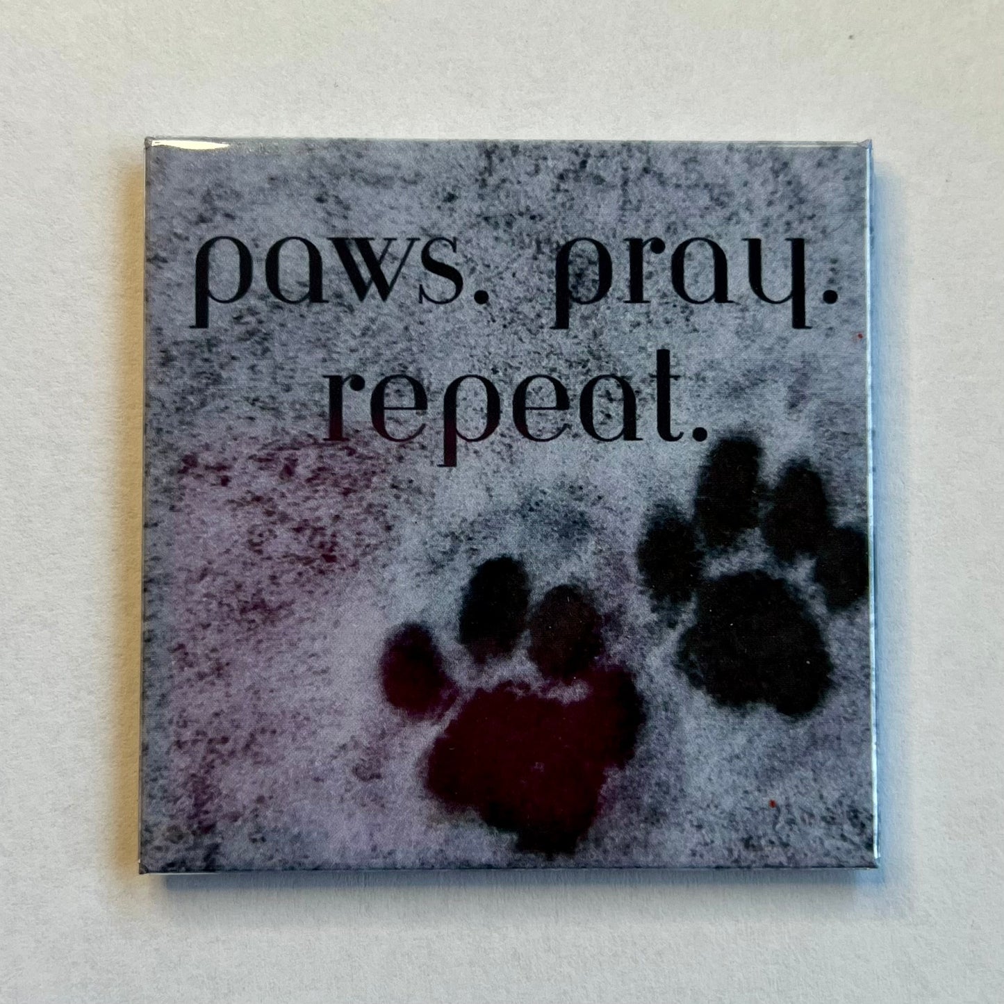 Christian dog magnet with snowy background and paw prints reading Paws Pray Repeat