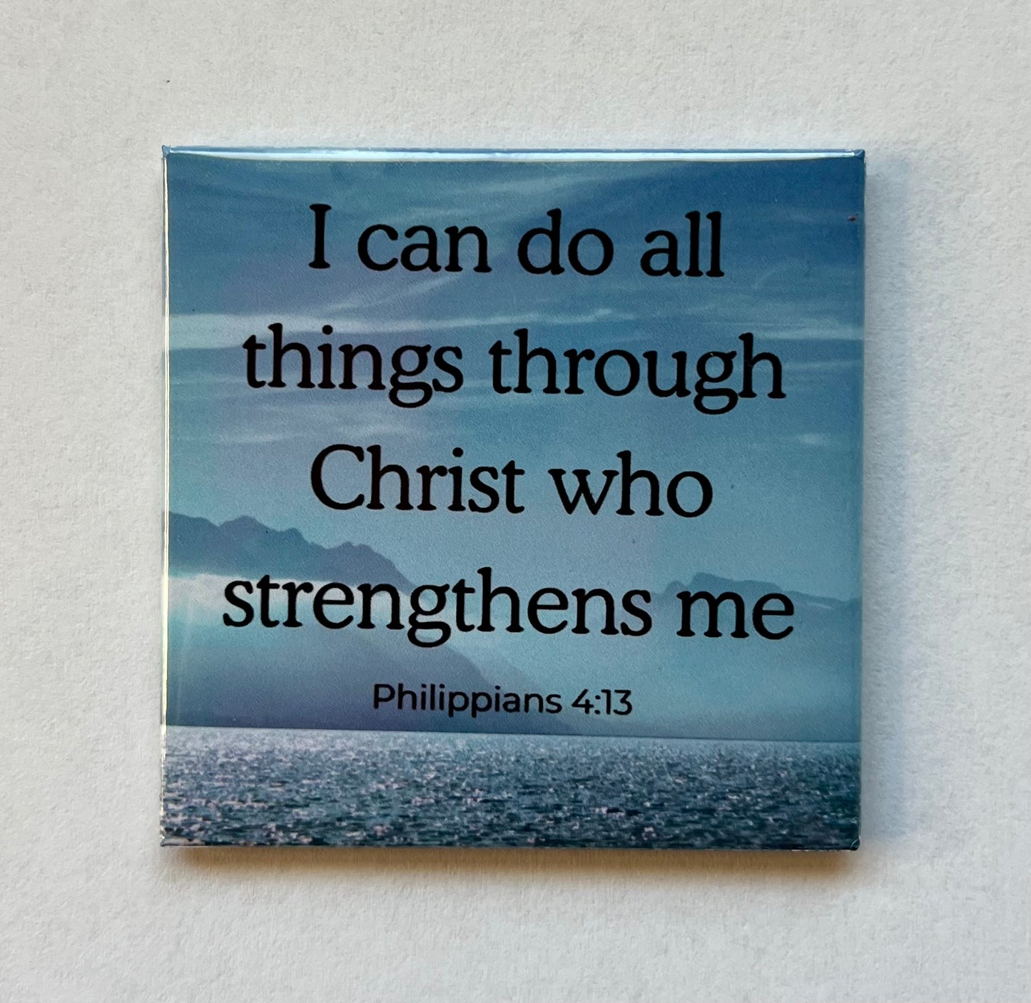 Christian magnet featuring a gray and blue mountain and ocean scene with Philippians 4:13 about strength through Christ