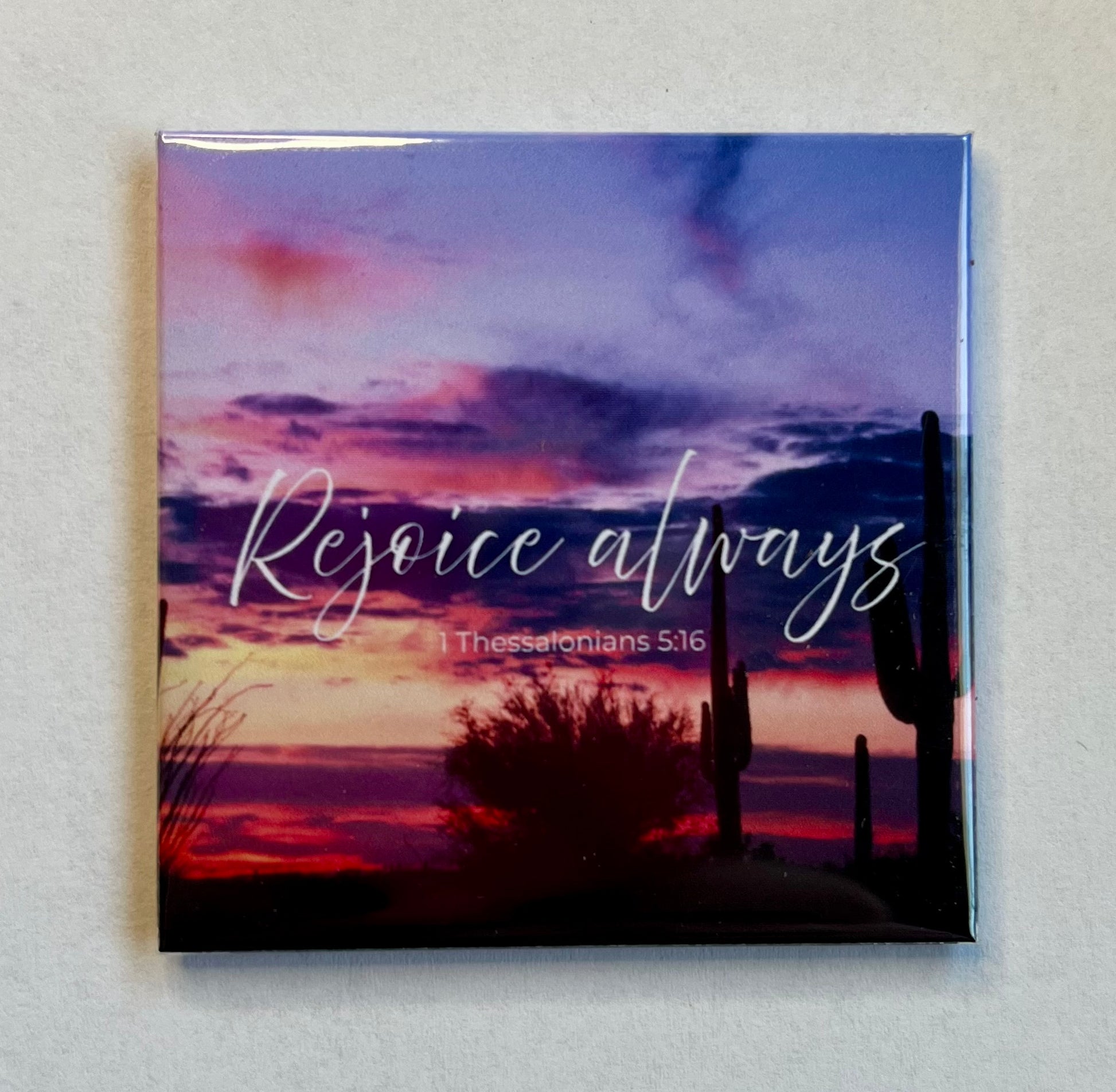 Bible verse magnet with desert sunset and saguaro silhouettes reading Rejoice Always 1 Thessalonians 5:16