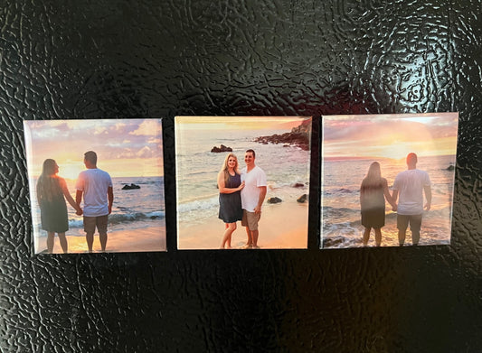 Set of 3 personalized 2x2 photo magnets on a refrigerator showing a couple on the beach
